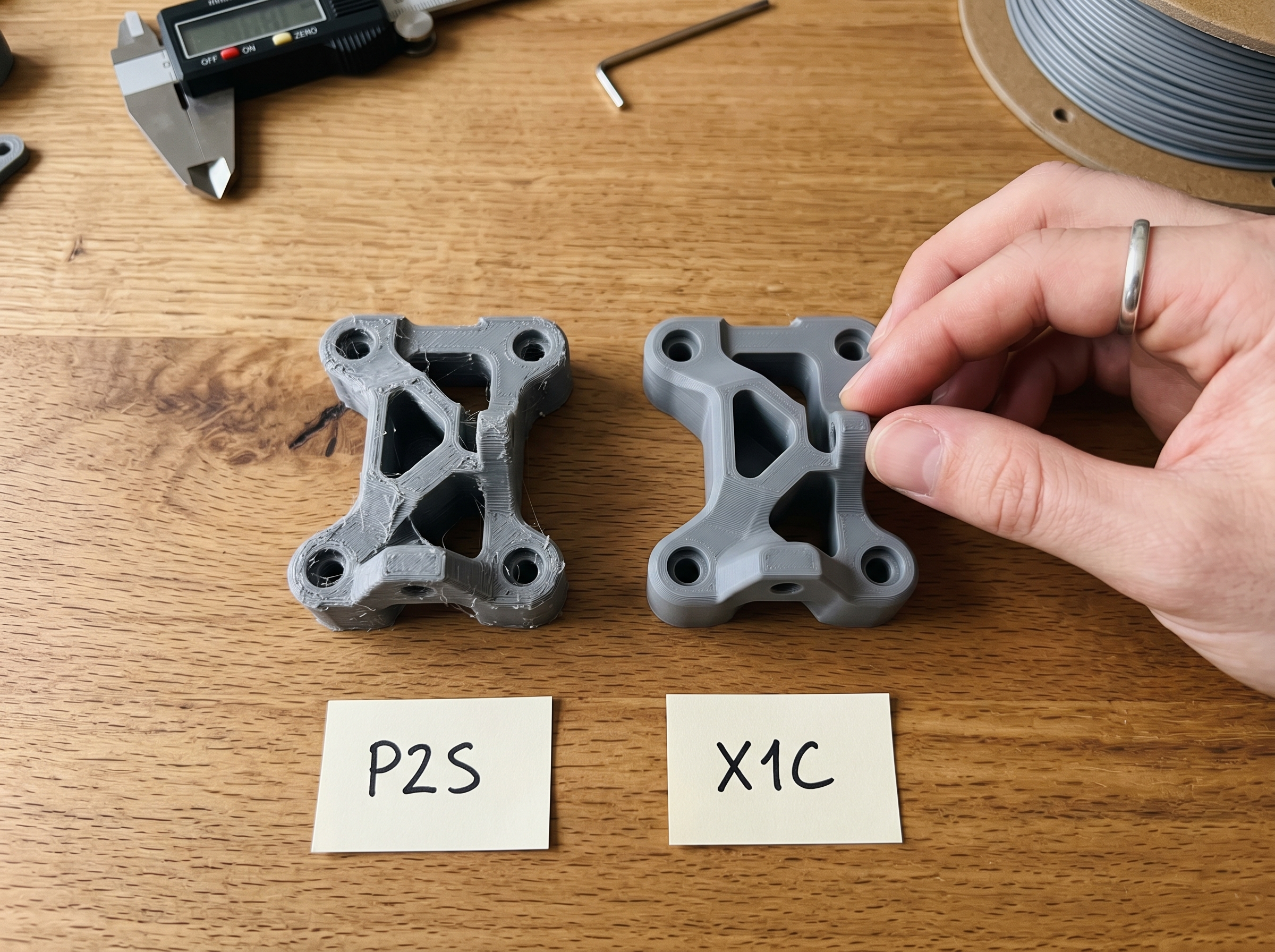 Side by side comparison of 3D printed parts from the Bambu P2S and X1 Carbon